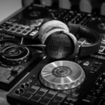 a pair of headphones sitting on top of a dj's decks