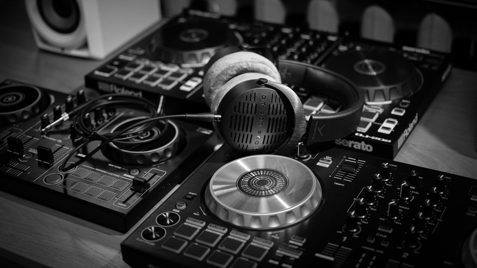 a pair of headphones sitting on top of a dj's decks