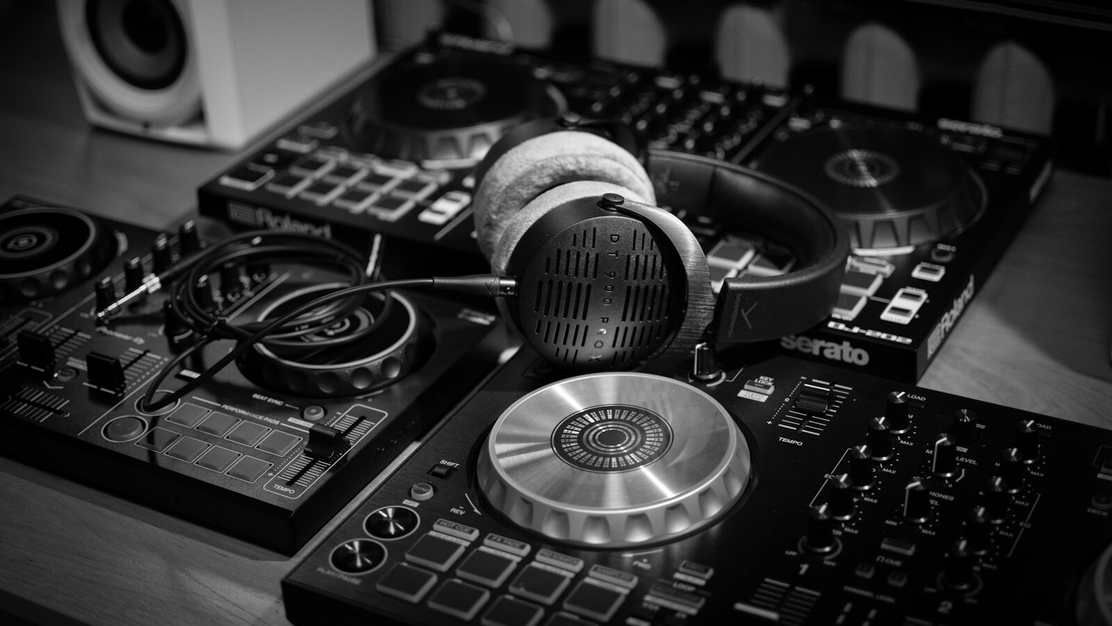 a pair of headphones sitting on top of a dj's decks